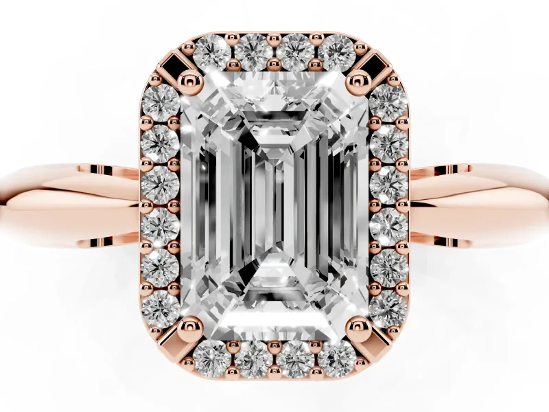 Emerald Cut Diamond Halo Engagement Ring Set in Rose gold with Plain Split Shank and Prong Setting