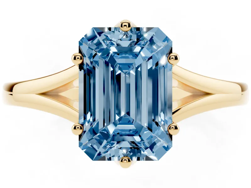 Fancy Blue Emerald Cut Diamond Solitaire Ring Set in Yellow gold with Polished Tapered Band and Prong Setting