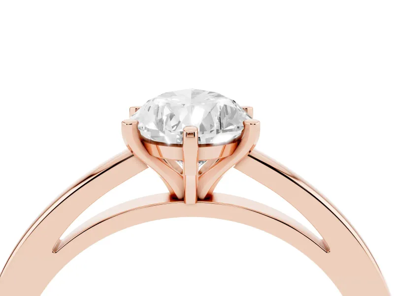 Pear Cut Diamond Solitaire Engagement Ring Set in Rose gold with Prong Setting on a Classic Band