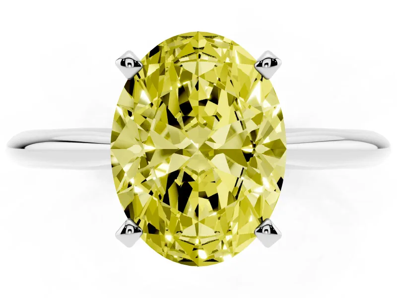 Fancy Yellow Oval Cut Diamond Solitaire Ring Set in White gold with Prong Setting on a Plain Round Band