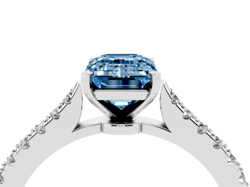 Fancy Blue Emerald Cut Diamond Solitaire Engagement Ring Set in Silver with Delicate Pavé Band and Prong Setting