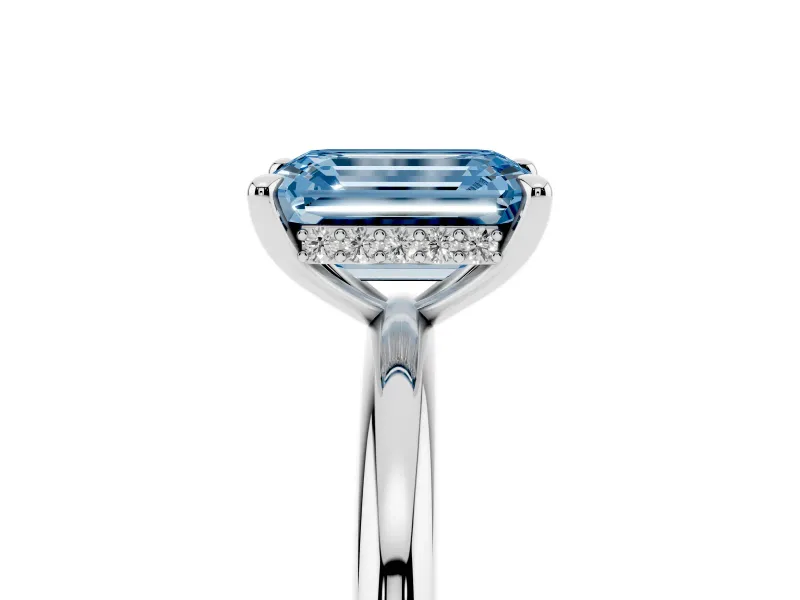 Fancy Blue Emerald Cut Diamond Solitaire Ring Set in White gold with Thin Band and Prong Setting