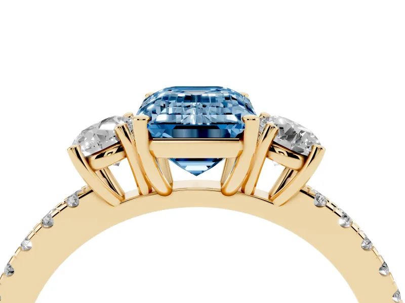 Emerald Cut Three Stone Engagement Ring Setting for a Fancy Blue Lab-Grown Diamond | Pave Shoulders | Yellow Gold