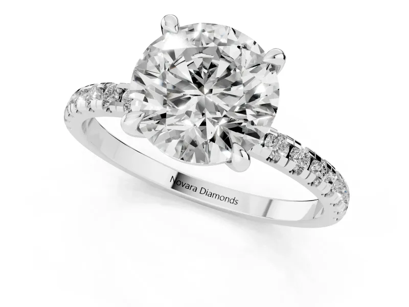 Round Cut Diamond Brilliant Solitaire Ring Set in Platinum with Pavé Band and Prong Setting