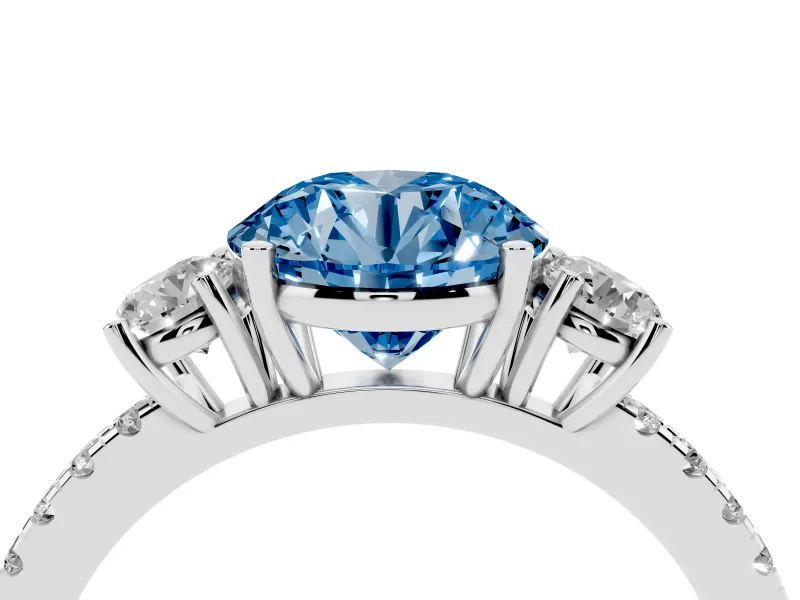 Fancy Blue Round Cut Diamond Three-Stone Ring Set in Platinum with Pavé Band and Graduated Sides