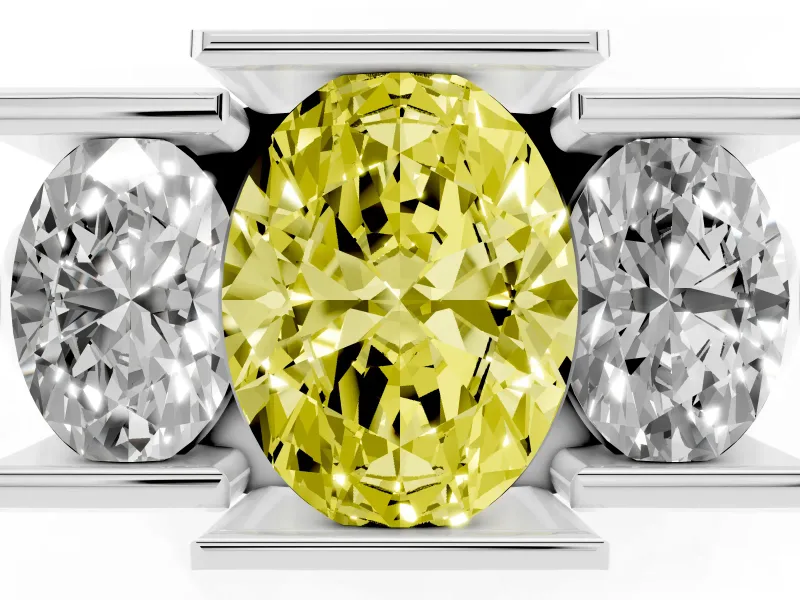 Fancy Yellow Oval Cut Diamond Three-Stone Channel Set Ring Set in White gold with Smooth Polished Band