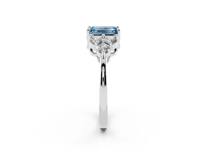 Fancy Blue Emerald Cut Diamond Solitaire Ring Set in White gold with Cluster Accents on Each Side