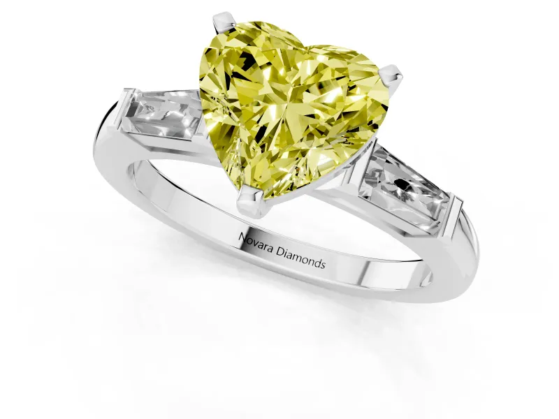 Fancy Yellow Heart Cut Diamond Solitaire Ring Set in Silver with Tapered Baguette Side Stones and Prong Setting