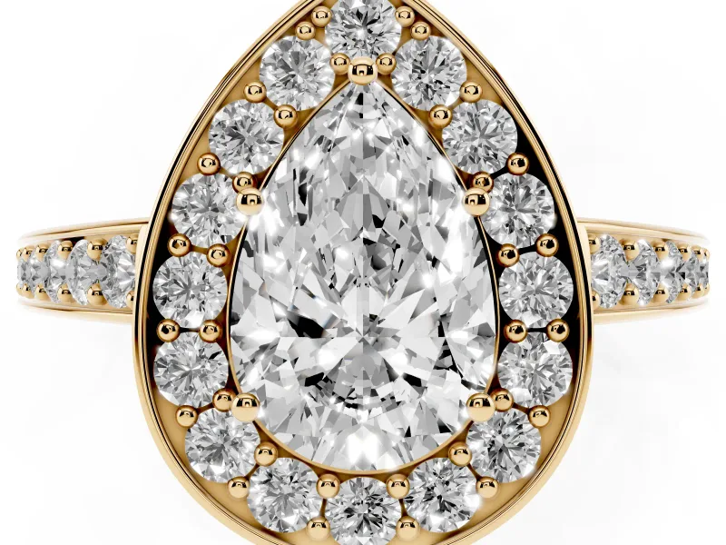 Pear Cut Diamond Halo Pavé Engagement Ring Set in Yellow gold with Bezel Setting