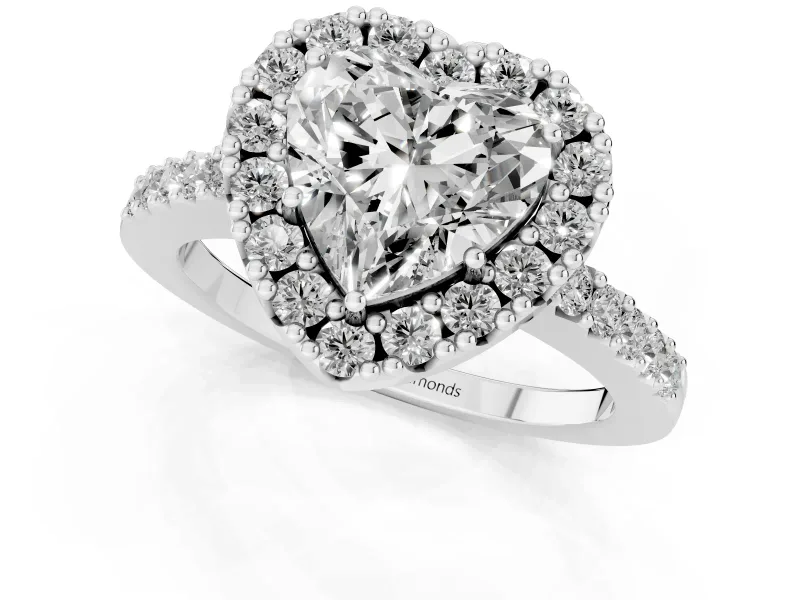 Heart Cut Diamond Halo Pavé Solitaire Ring Set in White gold with Prong-Set Center Stone