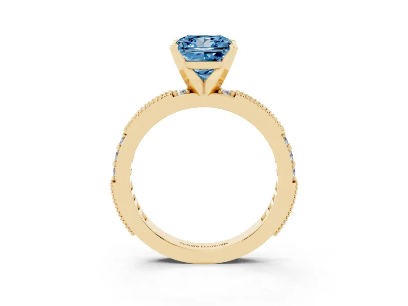 Fancy Blue Princess Cut Diamond Solitaire Ring Set in Yellow gold with Slim Pavé Band and Prong Setting