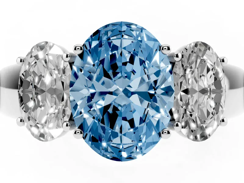 Fancy Blue Three-Stone Oval Cut Diamond Ring Set in Platinum with Matching Prong Settings and Plain Band