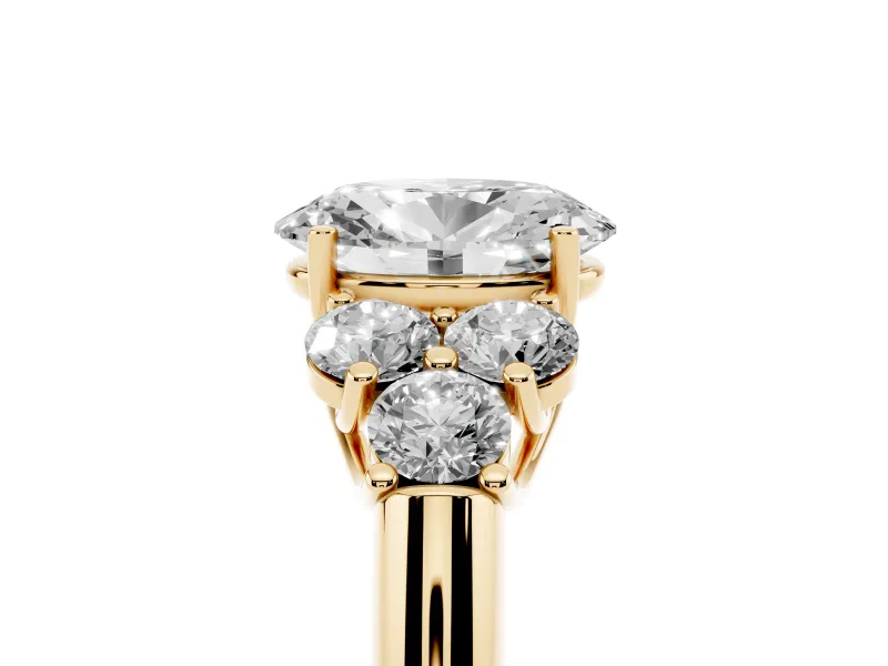 Oval Cut Diamond Cluster Ring Set in Yellow gold with Round Accent Stones and Prong Setting on a Plain Band
