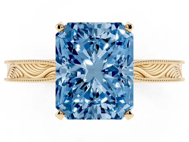 Fancy Blue Radiant Cut Diamond Solitaire Milgrain Engraved Band Set in Yellow gold with Prong Setting
