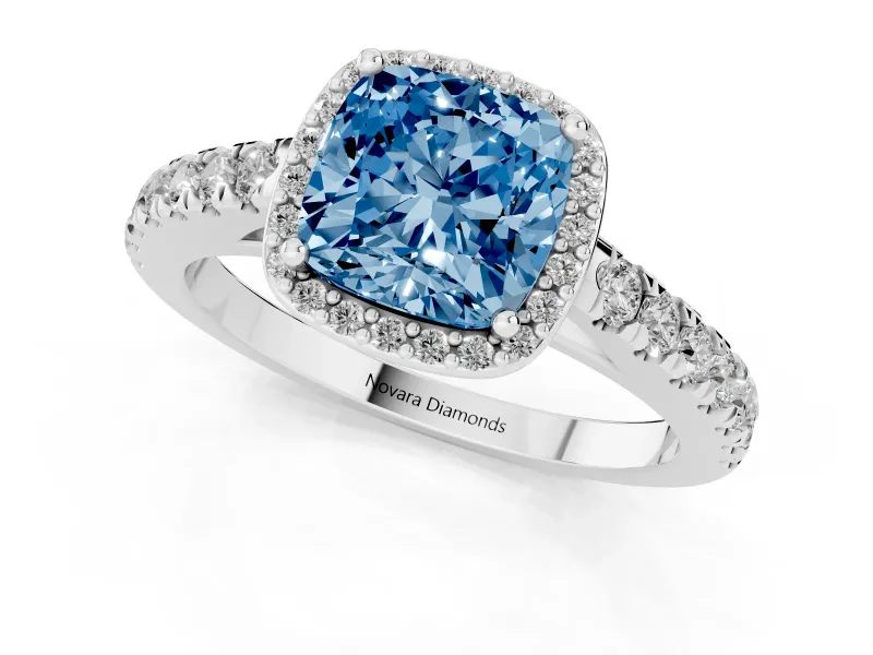 Fancy Blue Cushion Cut Diamond Halo Engagement Ring Set in White gold with Pavé Band and Prong Setting