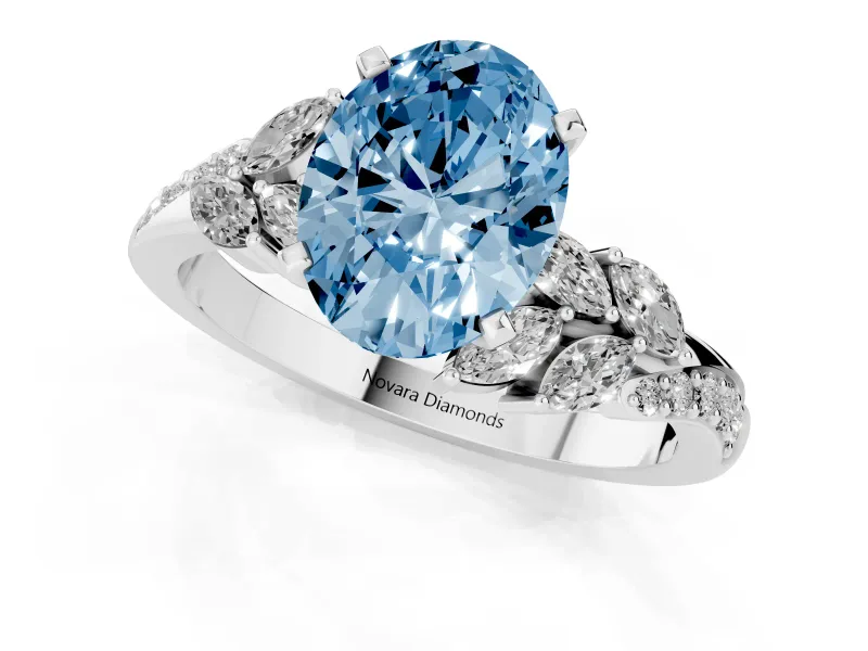 Fancy Blue Oval Cut Diamond Solitaire Ring Set in White gold with Marquise Twist Band and Prong Setting