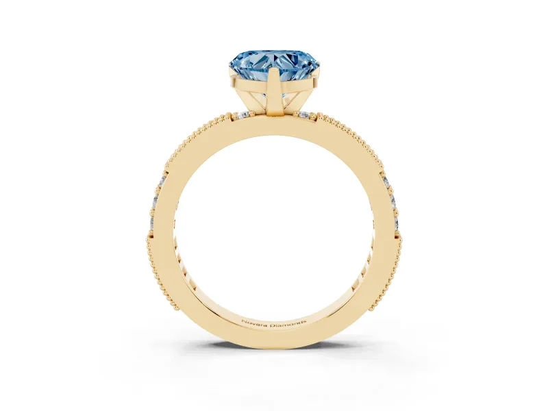 Fancy Blue Heart Cut Diamond Solitaire Ring Set in Yellow gold with Slim Pavé Band and Prong Setting