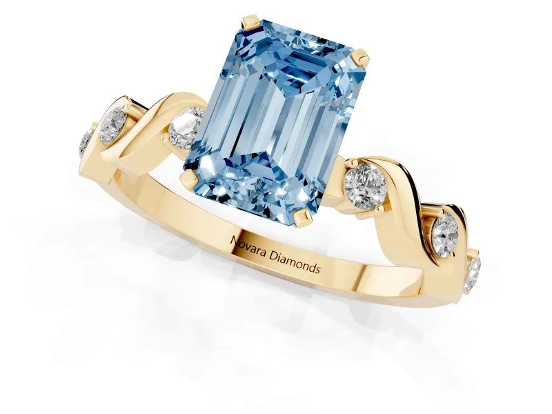 Emerald Cut Ribbon Twist Engagement Ring Setting for a Fancy Blue Lab-Grown Diamond | Accented Shoulders | Yellow Gold