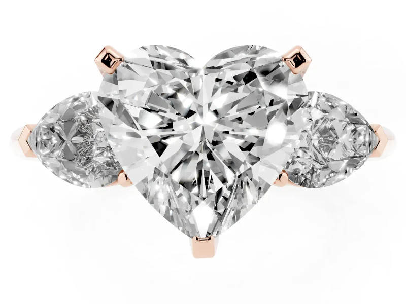 Three-Stone Heart Cut Diamond Ring Set in Rose gold with Pear Side Stones and Prong Setting