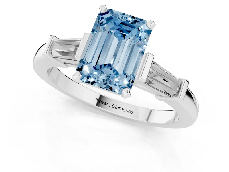 Fancy Blue Emerald Cut Diamond Solitaire Ring Set in Platinum with Tapered Baguette Accents and Prong Setting