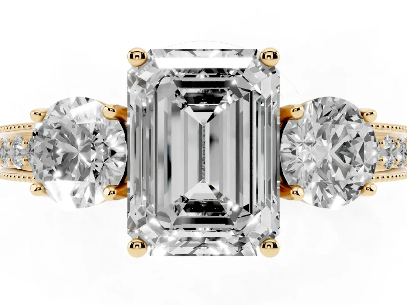 Emerald Cut Diamond Three-Stone Ring Set in Yellow gold with Round Side Stones and Pavé Band