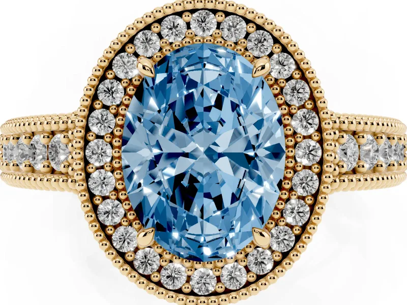 Fancy Blue Oval Cut Diamond Halo Ring Set in Yellow gold with Round Accent Halo, Pavé Band and Prong Setting