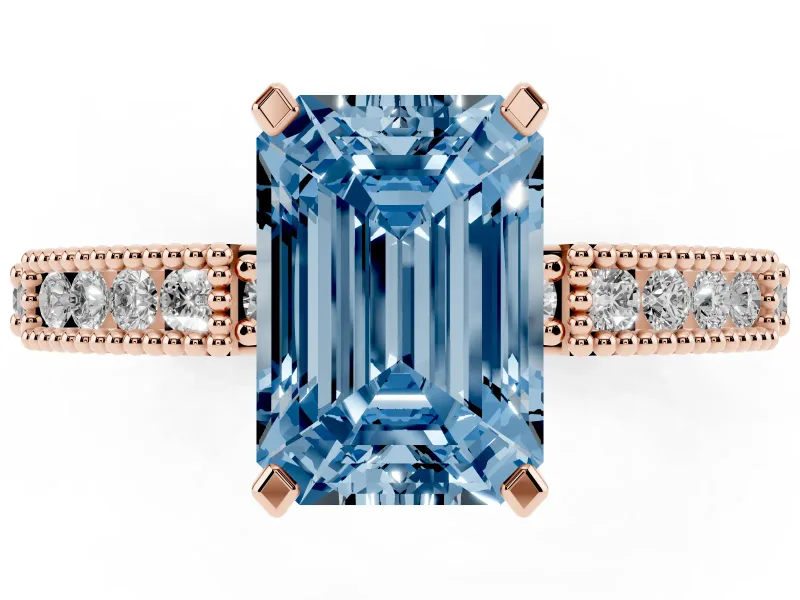 Fancy Blue Emerald Cut Diamond Solitaire Ring Set in Rose gold with Slim Pavé Band and Prong Setting