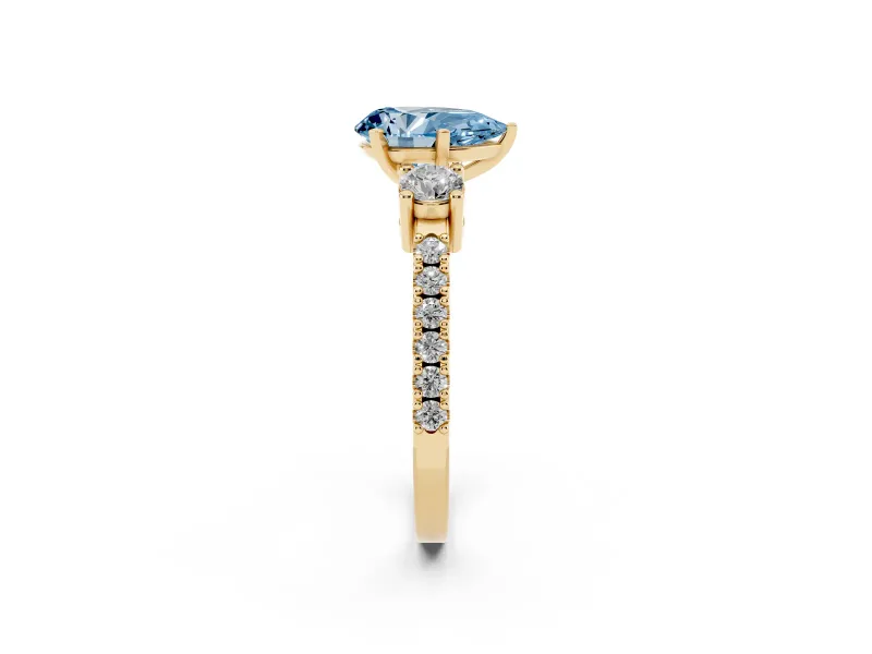 Fancy Blue Three-Stone Pear Cut Diamond Pavé Band Ring Set in Yellow gold with Prong Setting