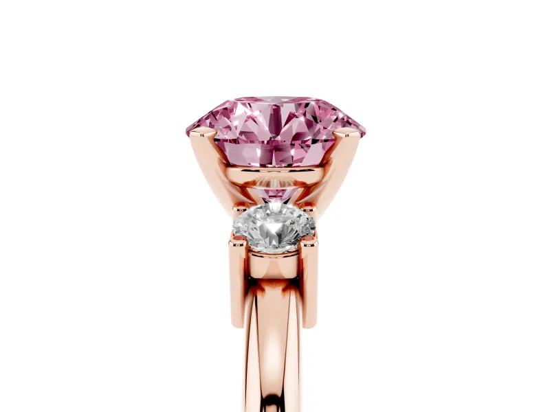Fancy Pink Three-Stone Round Cut Diamond Ring Set in Rose gold with Prong Setting and Plain Band