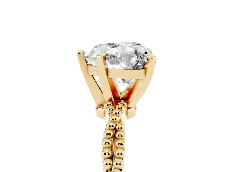 Heart Cut Diamond Solitaire Ring Set in Yellow gold with Twisted Band and Bead Prong Setting