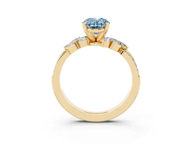 Fancy Blue Oval Cut Diamond Solitaire Ring Set in Yellow gold with Marquise Twist Band and Prong Setting