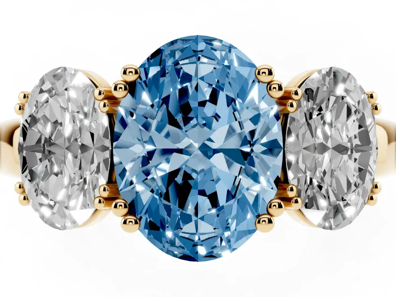 Fancy Blue Oval Cut Diamond Three-Stone Ring Set in Yellow gold with Polished Band and Prong Setting