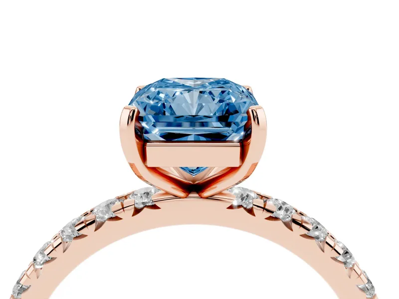 Fancy Blue Radiant Cut Diamond Pavé Solitaire Ring Set in Rose gold with Round Band and Prong Setting