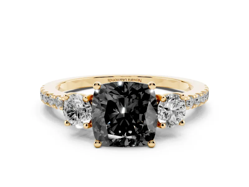 Fancy Black Cushion Cut Diamond Three-Stone Ring Set in Yellow gold with Pavé Band and Graduated Sides