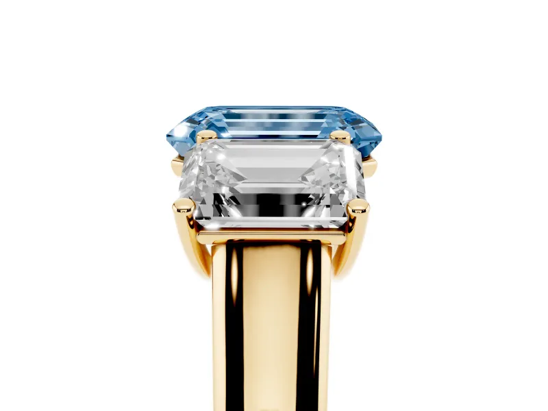 Emerald Cut Three Stone Engagement Ring Setting for a Fancy Blue Lab-Grown Diamond | Basket Prong Heads | Yellow Gold