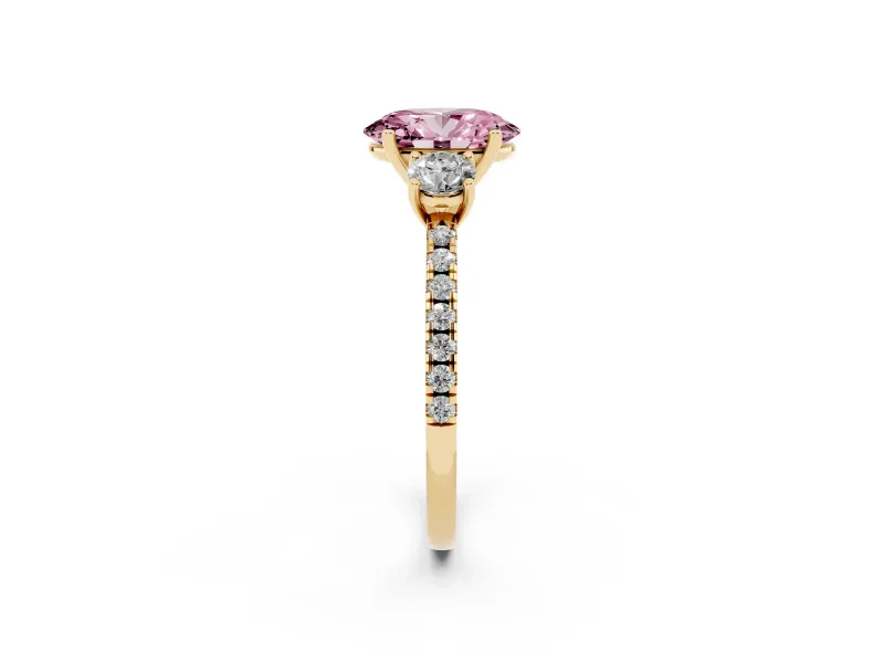 Fancy Pink Oval Cut Diamond Three-Stone Ring Set in Yellow gold with Pavé Band and Graduated Sides