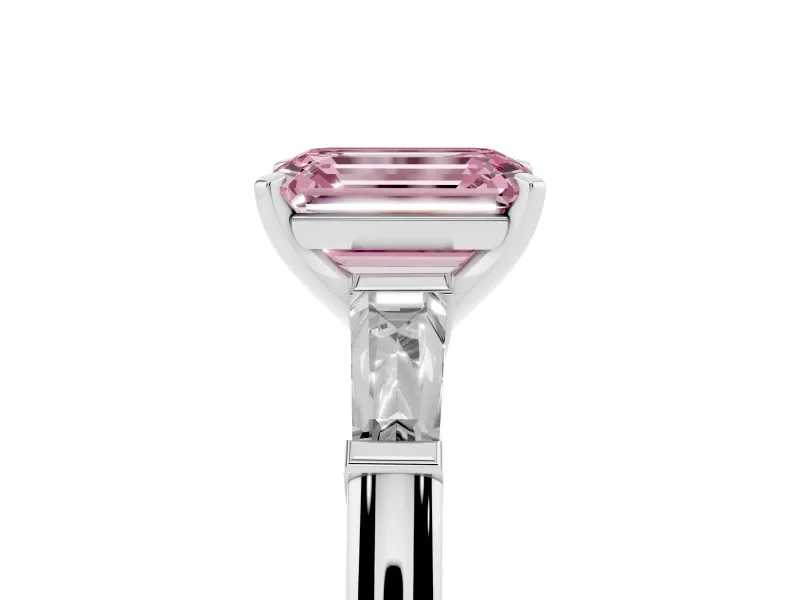 Fancy Pink Emerald Cut Diamond Solitaire Ring Set in White gold with Tapered Baguette Side Stones and Prong Setting