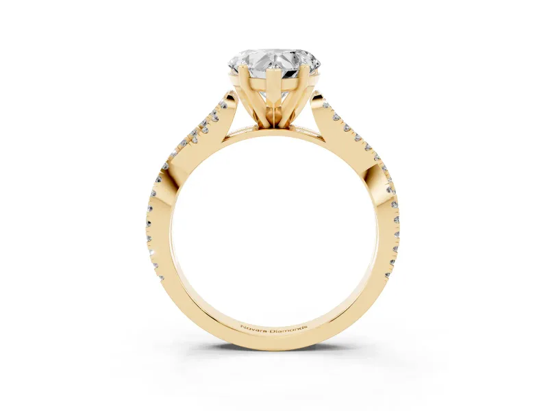 Heart Cut Diamond Solitaire Engagement Ring Set in Yellow gold with Twisted Pavé Band and Prong Setting