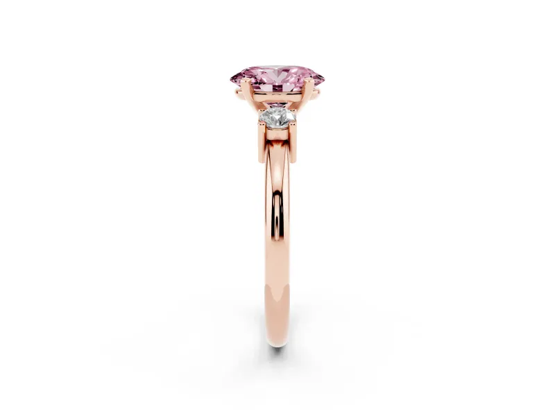 Fancy Pink Three-Stone Oval Cut Diamond Ring Set in Rose gold with Prong Setting and Plain Band