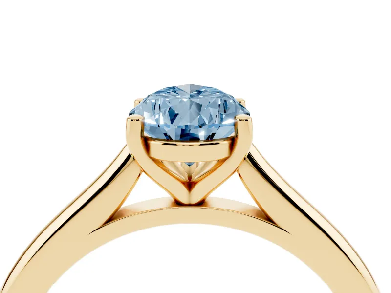 Fancy Blue Pear Cut Diamond Solitaire Ring Set in Yellow gold with Cathedral Band and Prong Setting