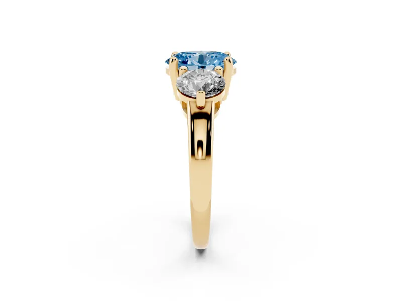 Fancy Blue Oval Cut Diamond Three-Stone Ring Set in Yellow gold with Prong Setting and Classic Band