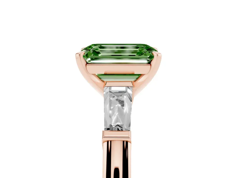 Fancy Green Emerald Cut Diamond Solitaire Ring Set in Rose gold with Tapered Baguette Side Stones and Prong Setting
