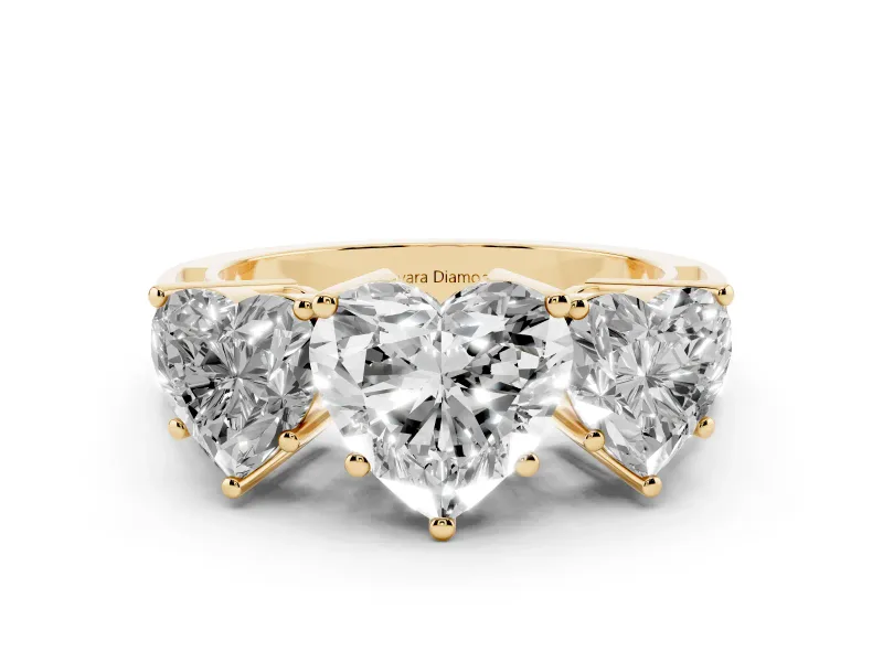 Heart Cut Diamond Three-Stone Ring Set in Yellow gold with Textured Band
