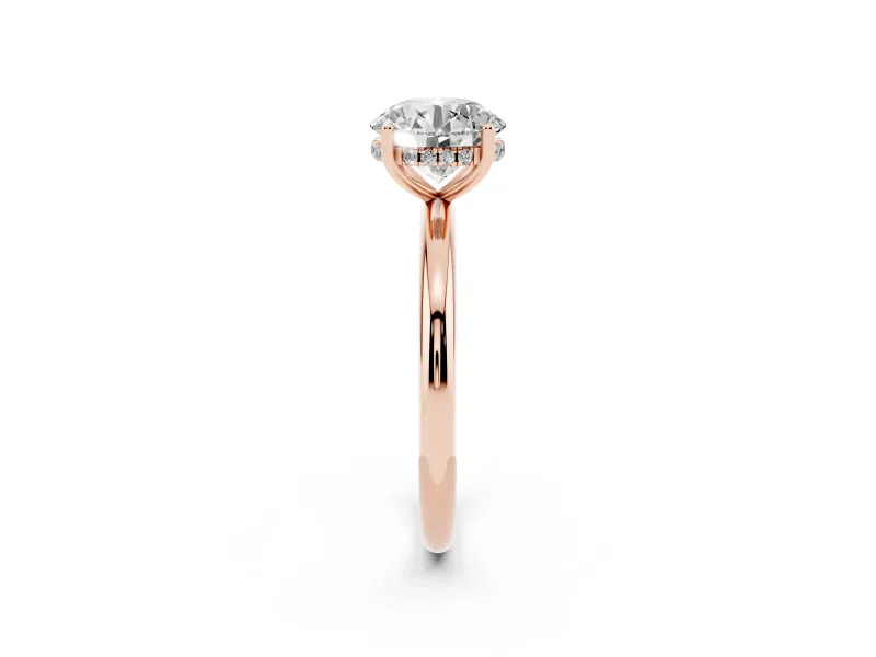Round Cut Diamond Solitaire Engagement Ring Set in Rose gold with Prong Setting and Polished Band