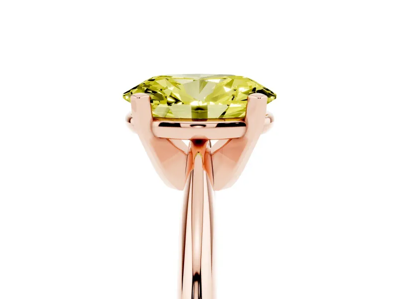Fancy Yellow Oval Cut Diamond Solitaire Ring Set in Rose gold with Prong Setting on a Plain Round Band