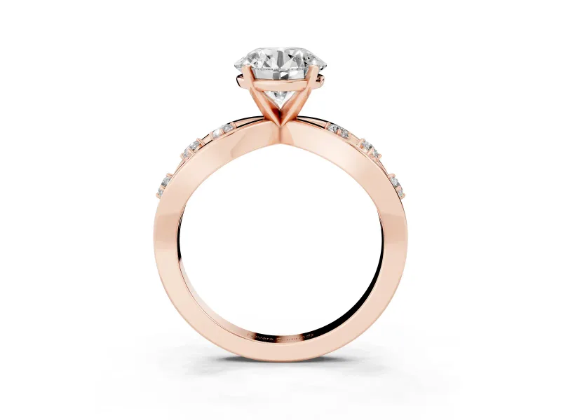 Round Cut Diamond Solitaire Ring Set in Rose gold with Side Stones on Criss-Cross Band and Prong Setting
