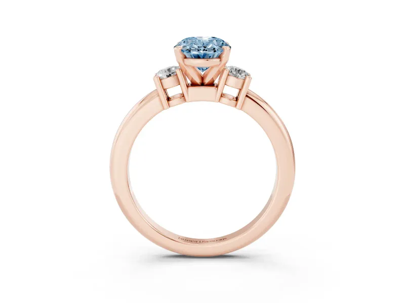 Fancy Blue Three-Stone Oval Cut Diamond Ring Set in Rose gold with Prong Setting and Plain Band
