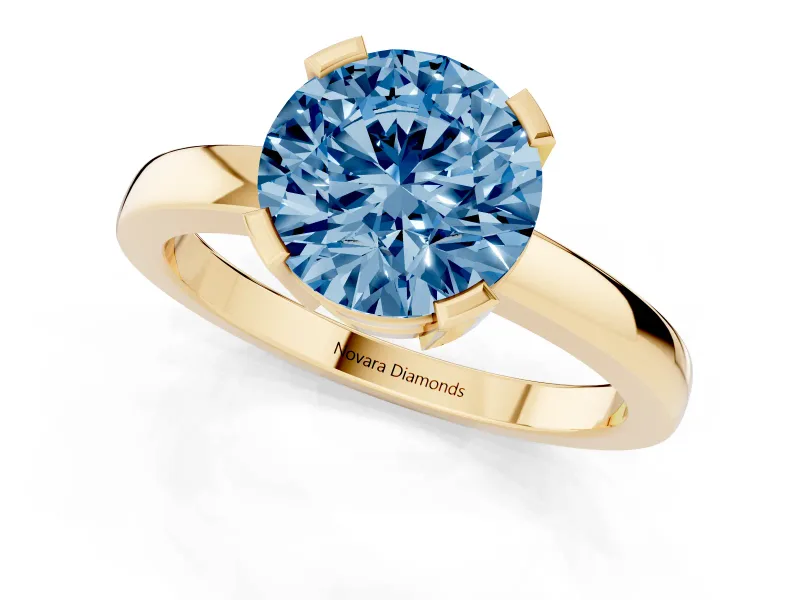 Fancy Blue Round Cut Diamond Solitaire Ring Set in Yellow gold with Prong Head and Smooth Polished Band