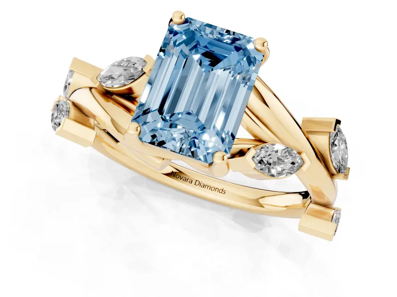 Fancy Blue Emerald Cut Diamond Solitaire Ring Set in Yellow gold with Twisted Marquise Accent Band