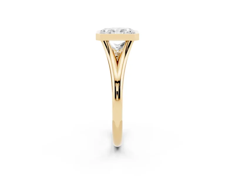 Bezel Set Radiant Cut Diamond Solitaire Ring Set in Yellow gold with Tapered Band